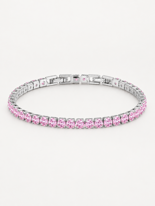 Silver tennis bracelet with pink zirconia stones on a neutral background