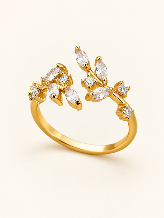 Gold leaf branch zirconia ring on a neutral background