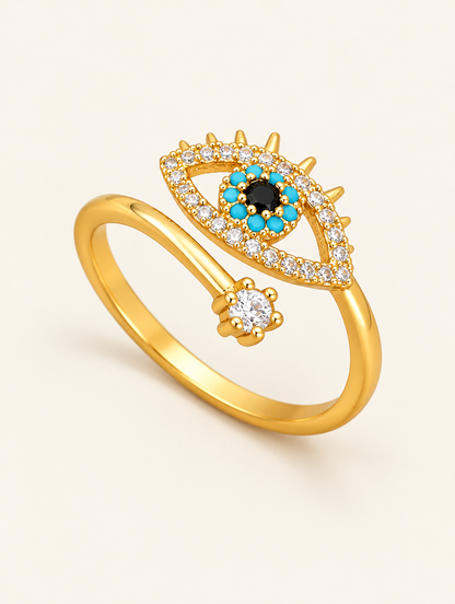 Gold evil eye zirconia ring on a neutral background