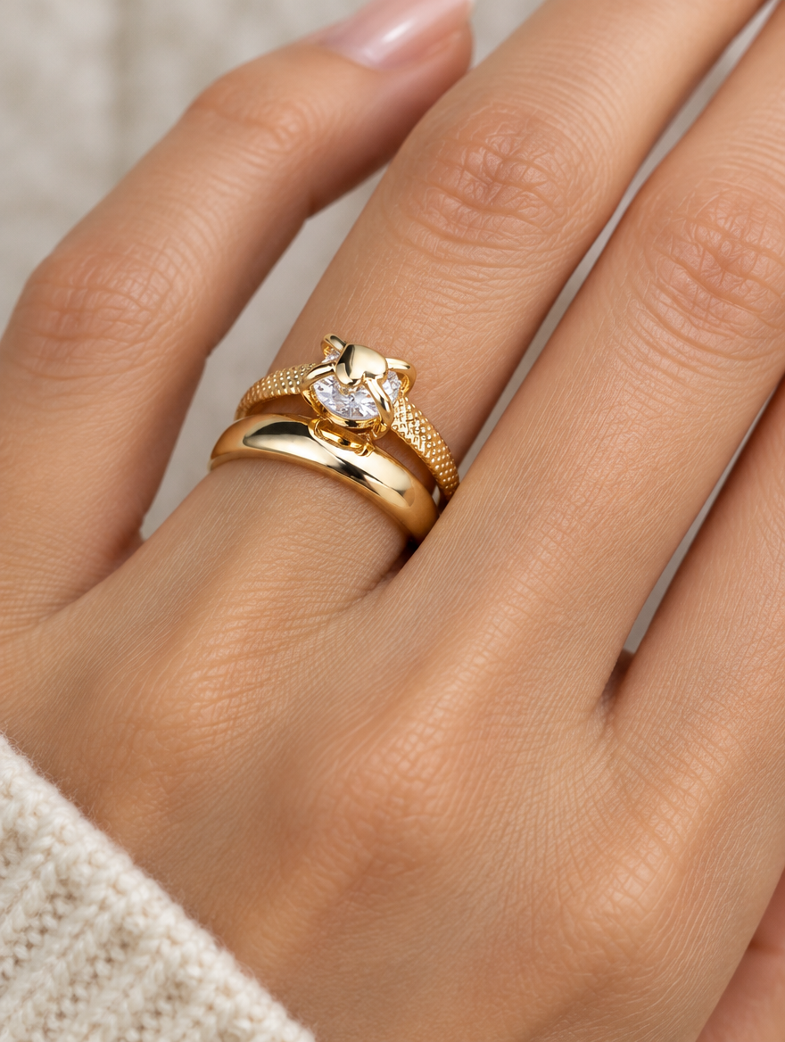 Woman wearing a gold double band zirconia ring on her finger