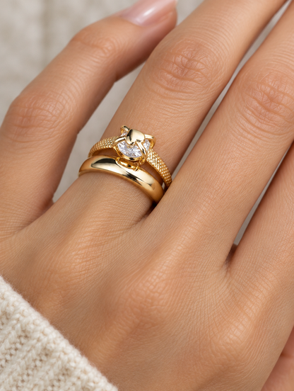 Woman wearing a gold double band zirconia ring on her finger