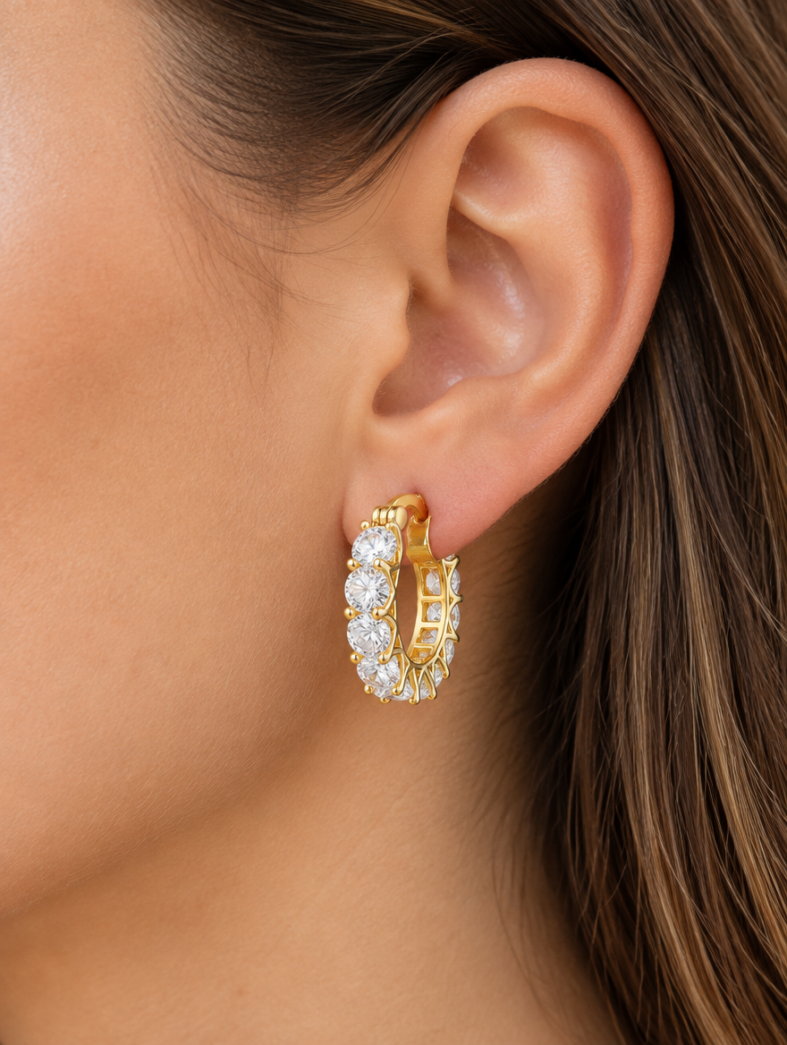Woman wearing a gold zirconia hoop earring
