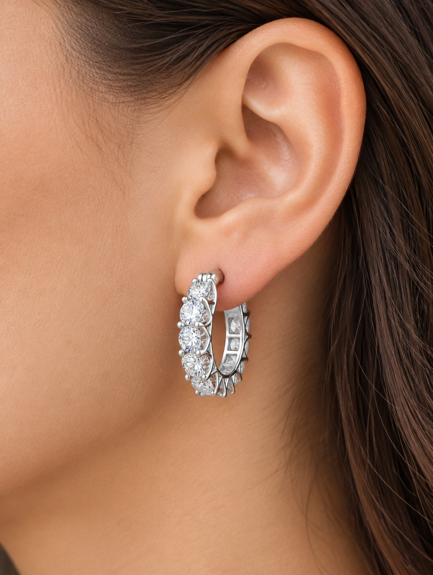 Woman wearing a silver zirconia hoop earring