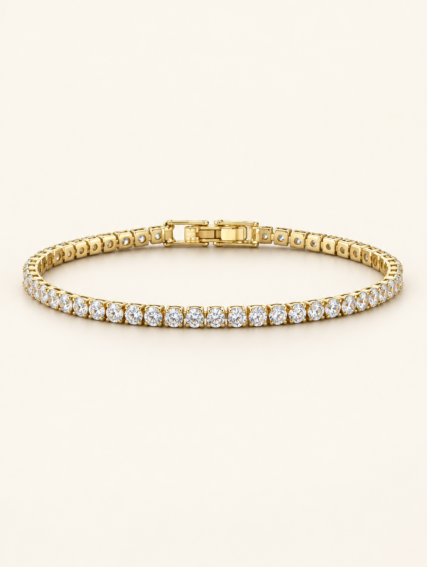 Gold zirconia tennis bracelet with a single row of clear stones on a neutral background