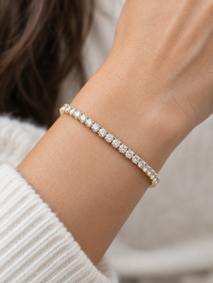 Woman wearing a gold zirconia tennis bracelet