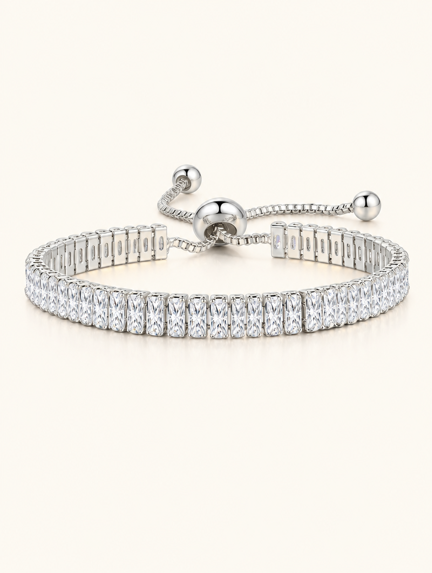 Silver baguette zirconia slider tennis bracelet on a neutral background