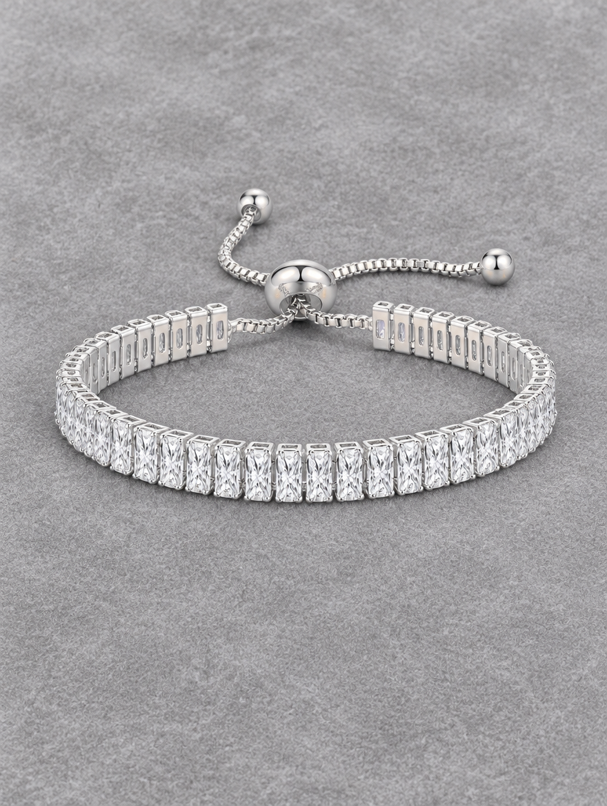 Silver slider tennis bracelet with two rows of stones on grey velvet