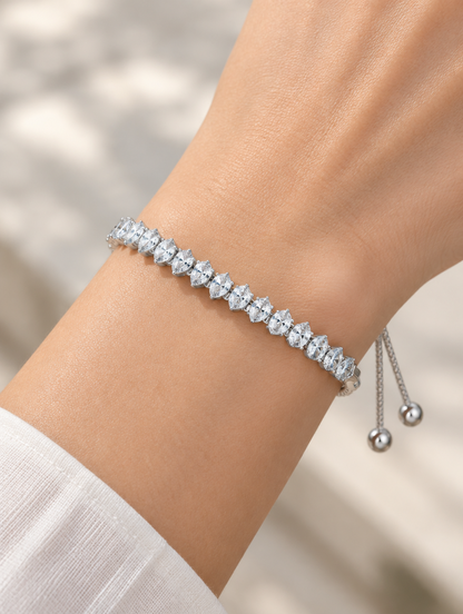 Woman wearing a silver pear zirconia slider bracelet