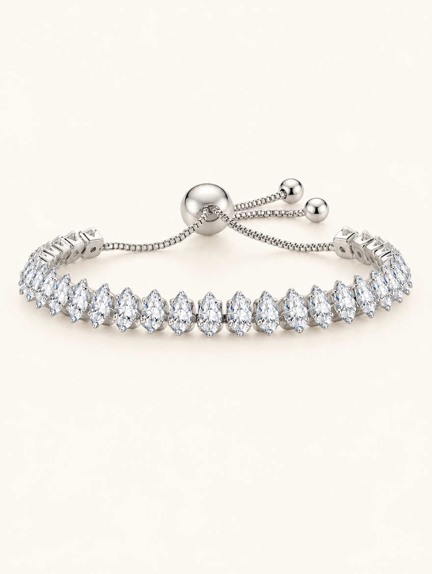 Silver pear zirconia slider tennis bracelet on a neutral background