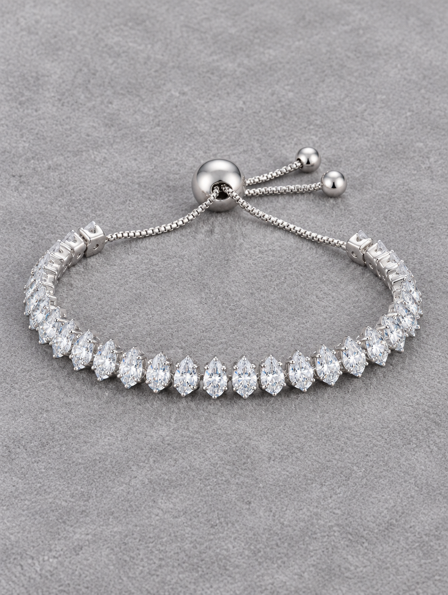 Silver slider bracelet with pear-cut stones on grey velvet