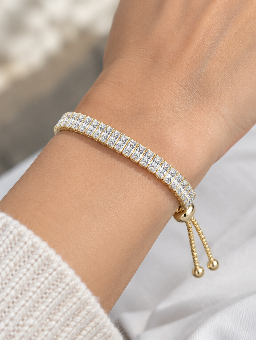 Woman wearing a gold baguette zirconia slider bracelet