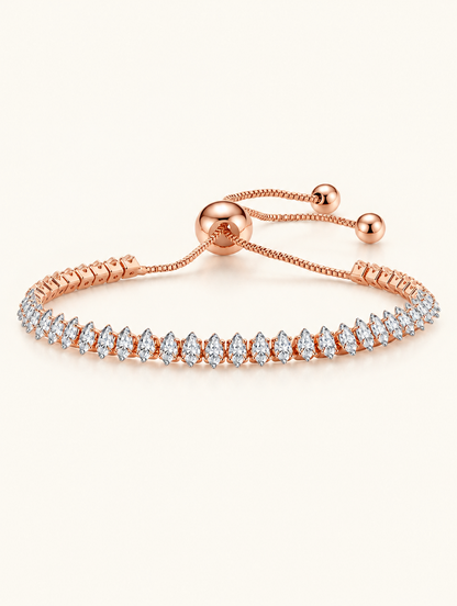 Rose gold pear zirconia slider tennis bracelet on a neutral background