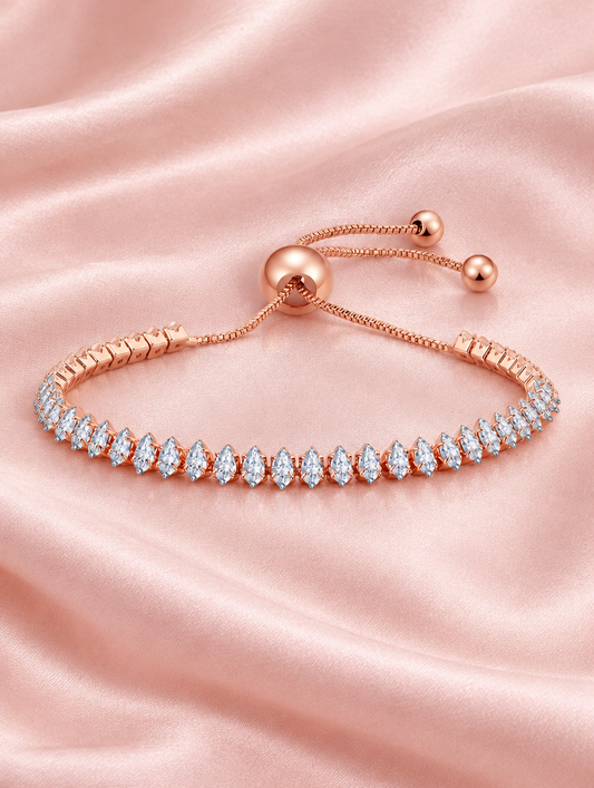 Rose gold slider bracelet with pear-cut stones on blush silk