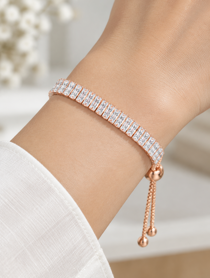 Woman wearing a rose gold baguette zirconia slider bracelet