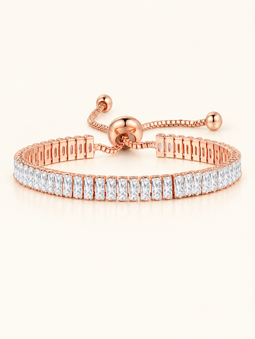 Rose gold baguette zirconia slider tennis bracelet on a neutral background