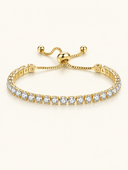 Gold round zirconia slider tennis bracelet on a neutral background