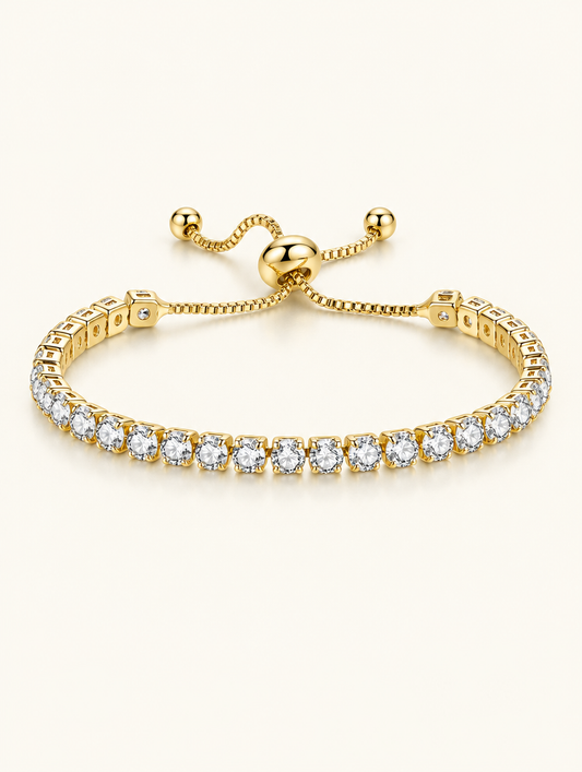 Gold round zirconia slider tennis bracelet on a neutral background