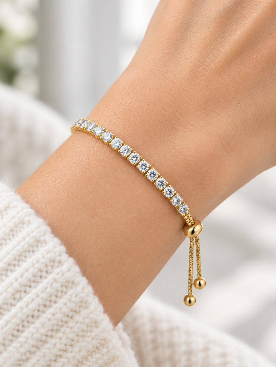 Woman wearing a gold round zirconia slider bracelet