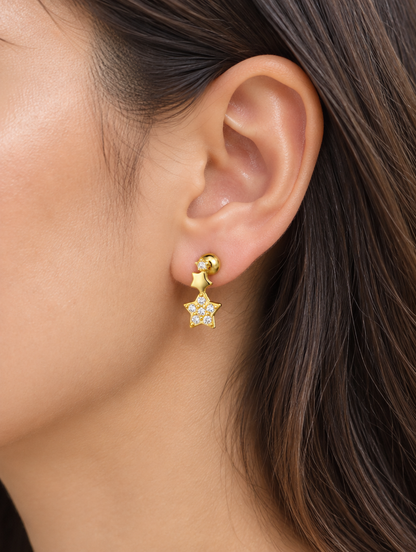 Woman wearing a gold star stud earring