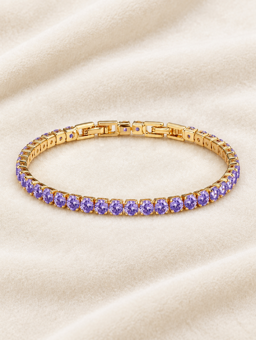 Gold purple zirconia tennis bracelet on cream velvet