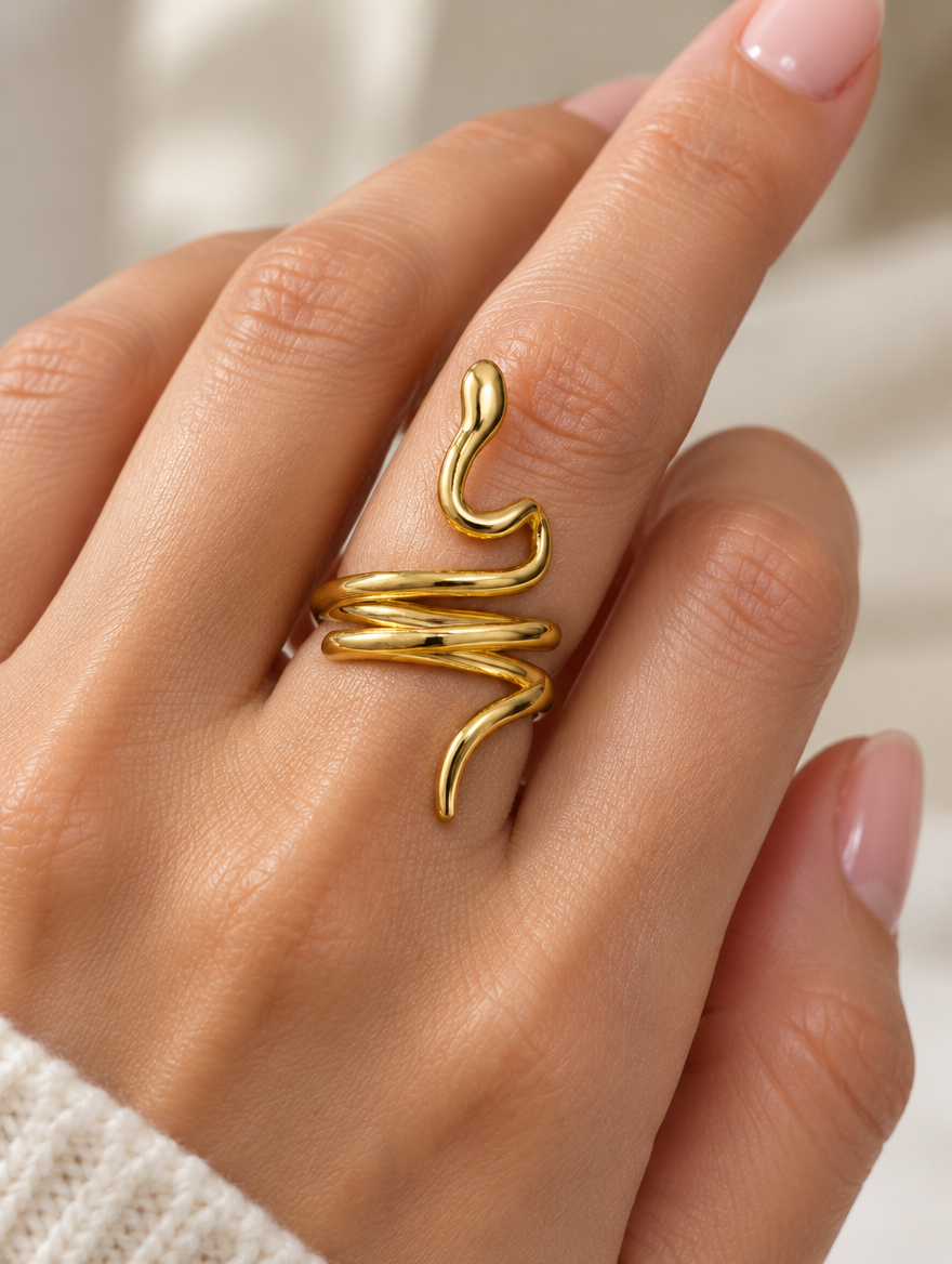 Woman wearing a gold snake coil ring on her finger