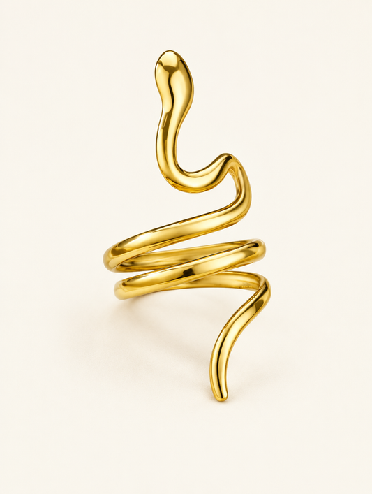 Gold snake coil ring on a neutral background