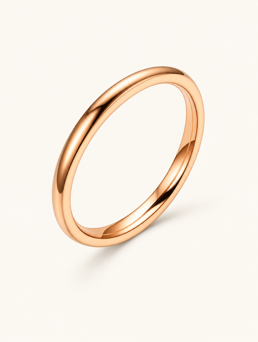 Thin rose gold polished band ring on a neutral background