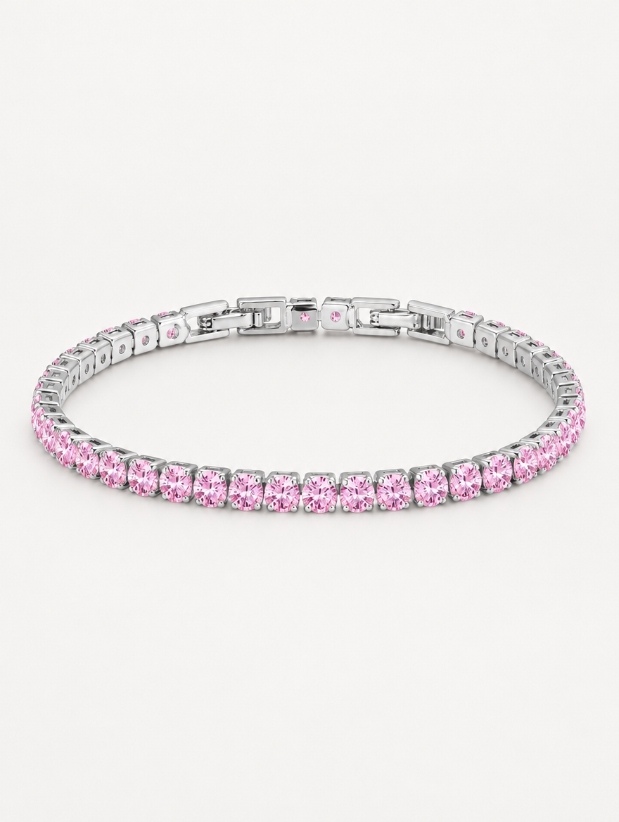 Silver tennis bracelet with pink zirconia stones on a neutral background
