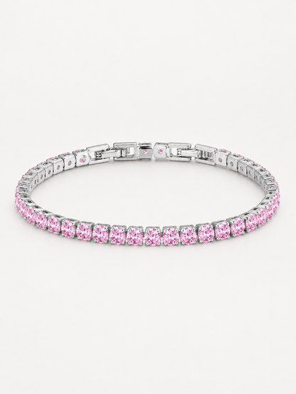Silver tennis bracelet with pink zirconia stones on a neutral background