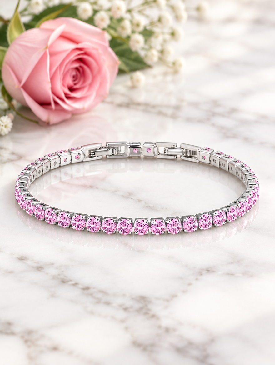 Silver pink zirconia bracelet beside a pink rose on white marble
