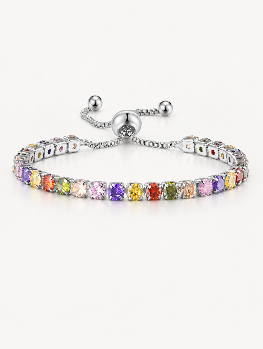 Silver slider tennis bracelet with rainbow zirconia stones on a neutral background