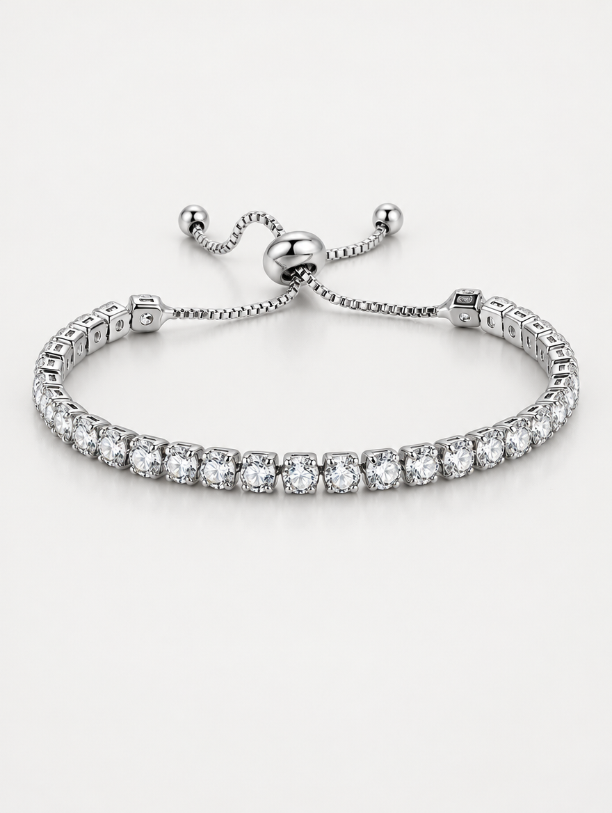 Silver slider tennis bracelet with clear zirconia stones on a neutral background