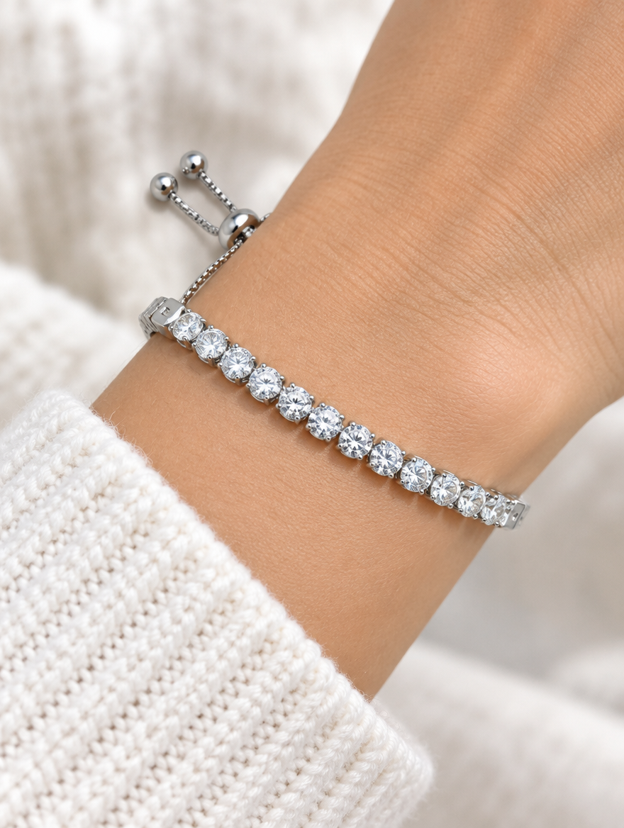Woman wearing a silver slider tennis bracelet with clear zirconia stones