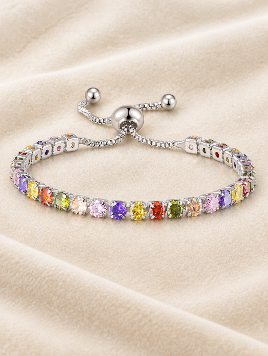 Silver rainbow zirconia slider bracelet on cream velvet