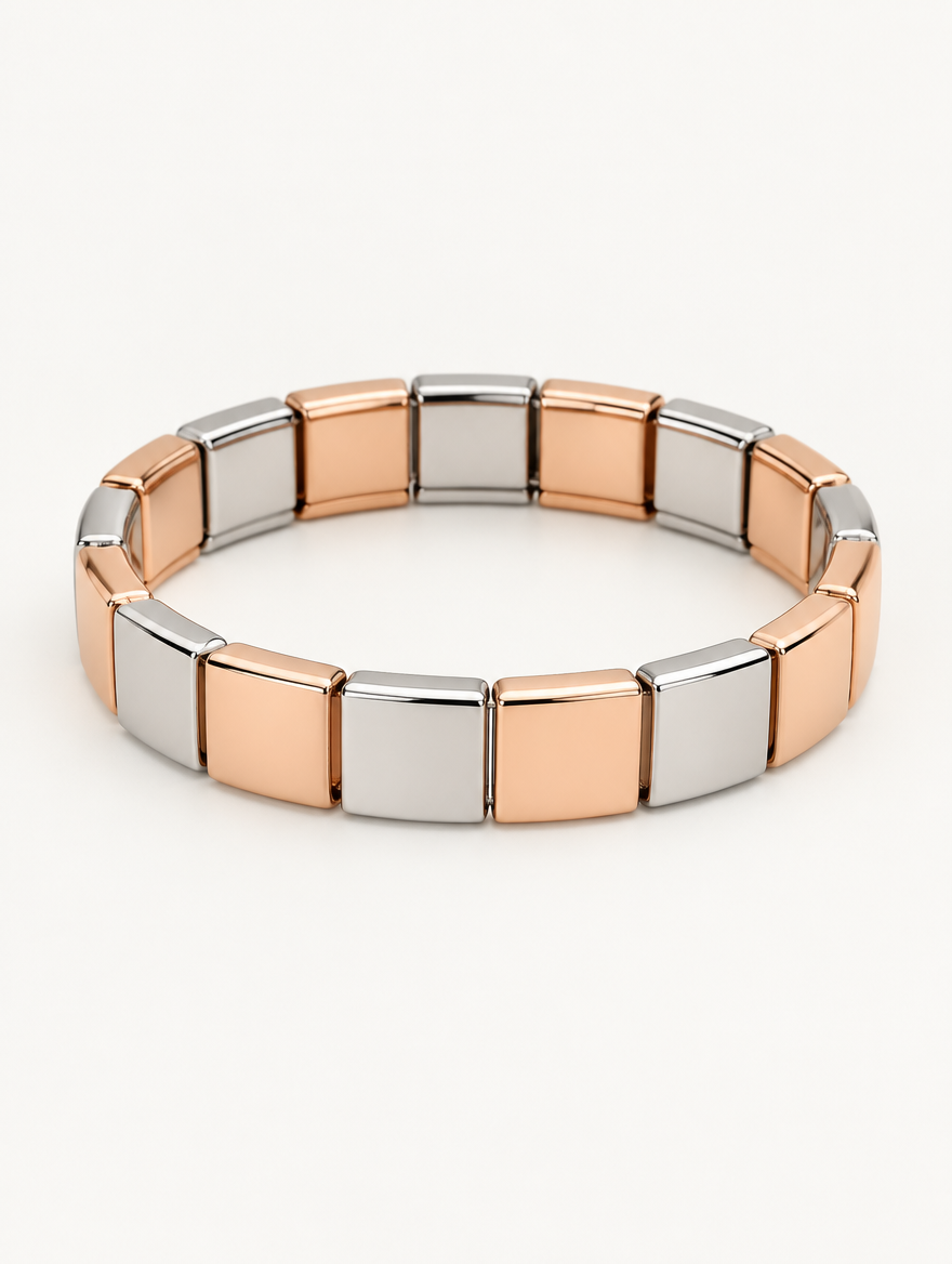 Rose gold and silver two-tone stainless steel stretch bracelet on a neutral background
