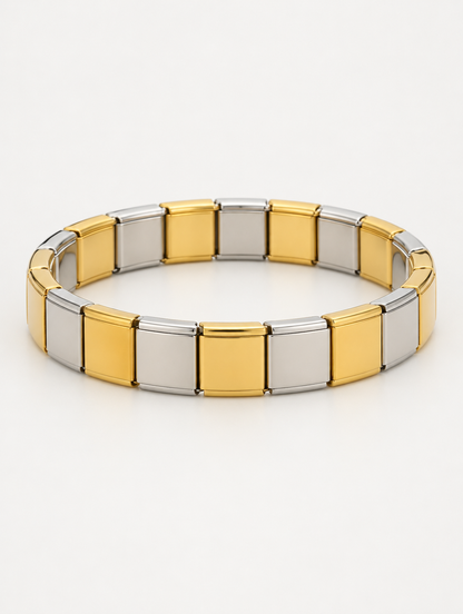 Two-tone gold and silver stainless steel stretch bracelet on a neutral background