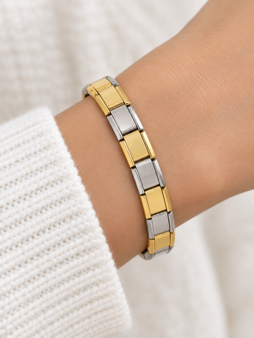 Woman wearing a two-tone gold and silver link bracelet