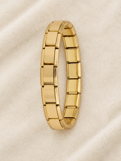 Gold-tone link stretch bracelet on cream velvet