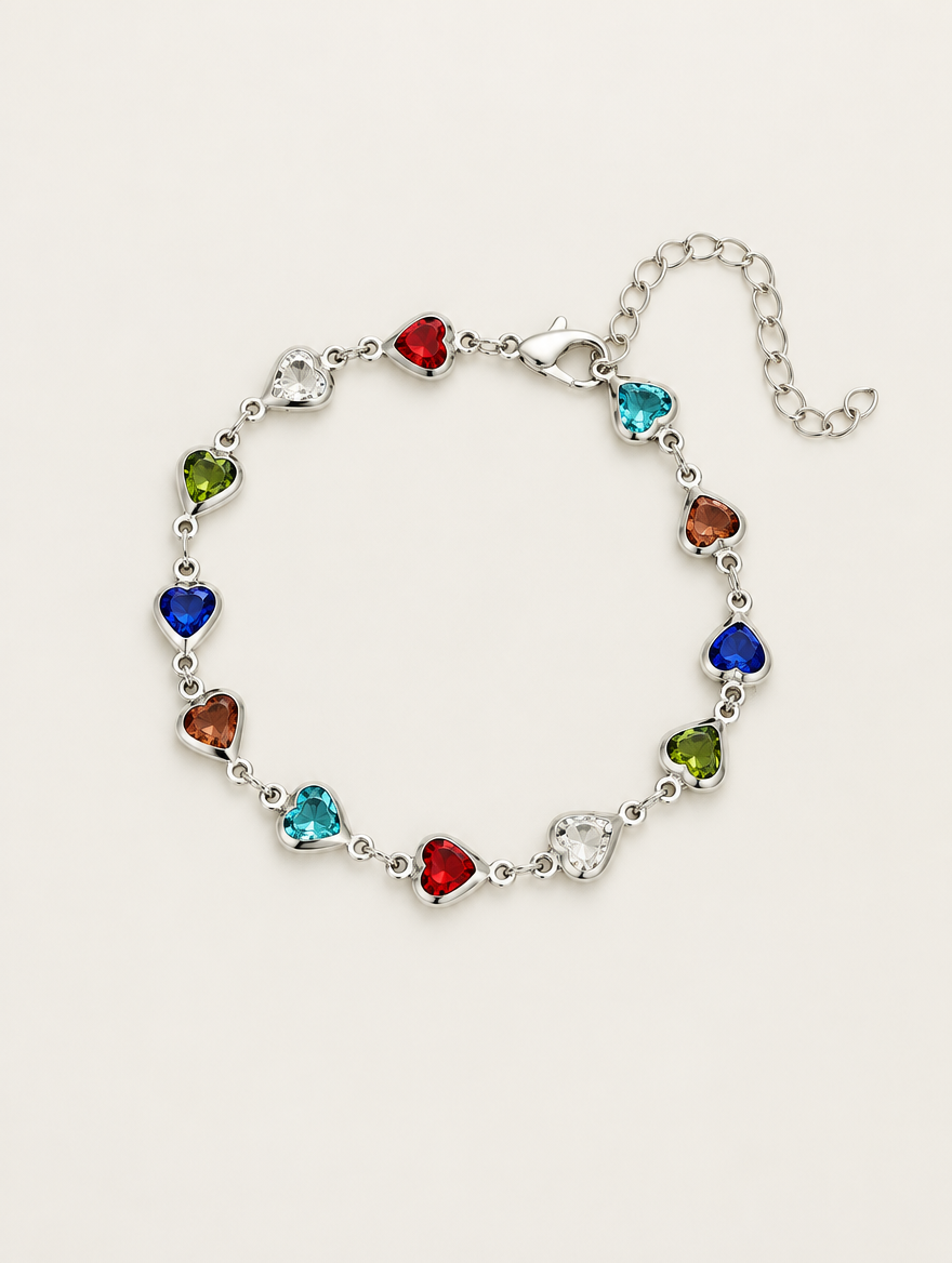 Silver-tone chain bracelet with multicolour crystal hearts on a neutral background