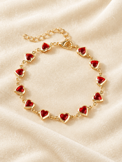 Gold red crystal heart bracelet on cream velvet