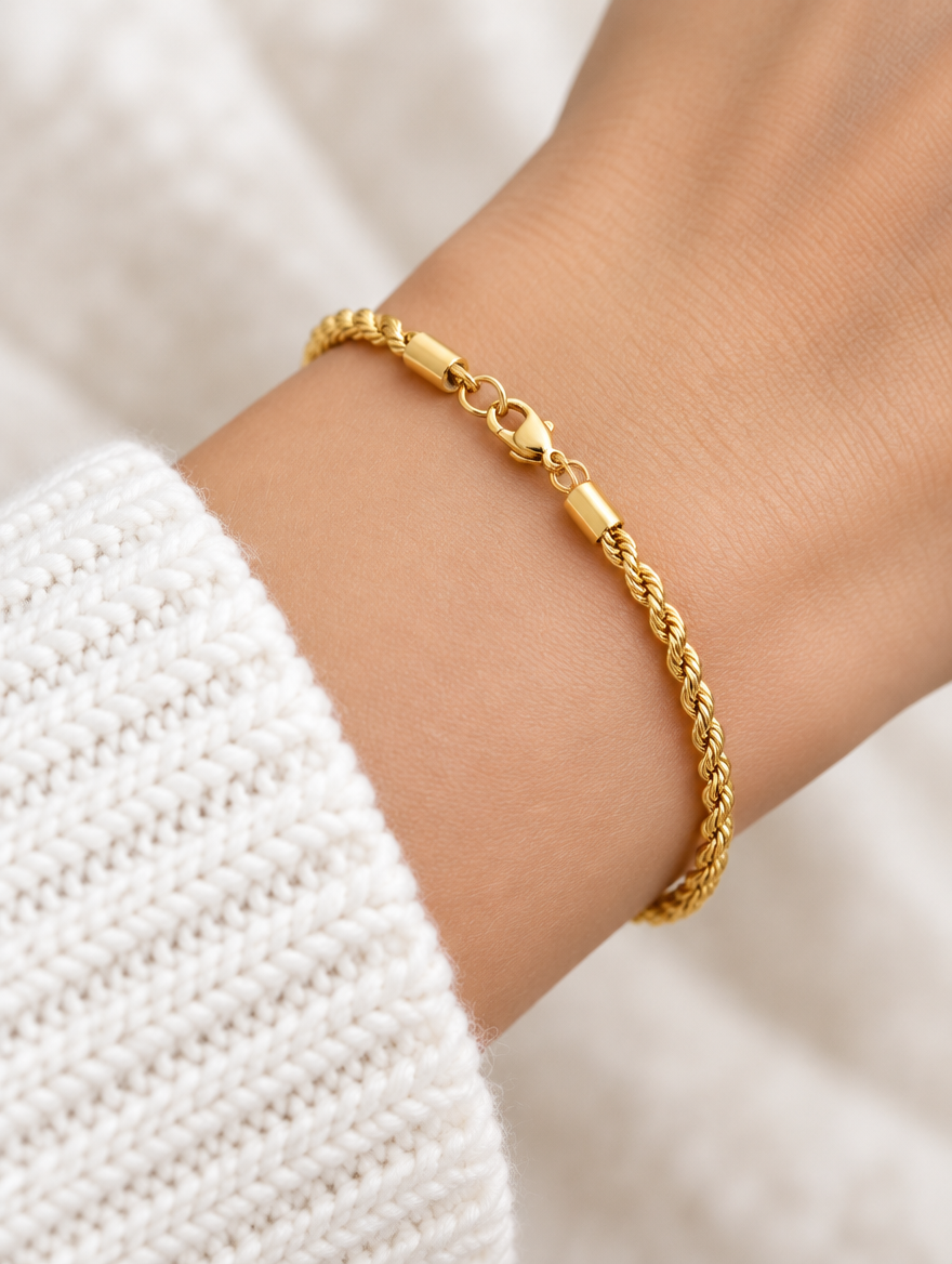 Woman wearing a gold twisted rope chain bracelet
