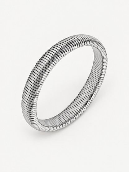 Silver wide ribbed stretch bracelet on a neutral background