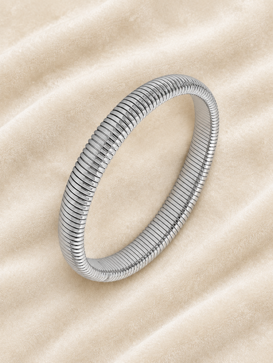 Silver ribbed stretch bracelet on cream velvet