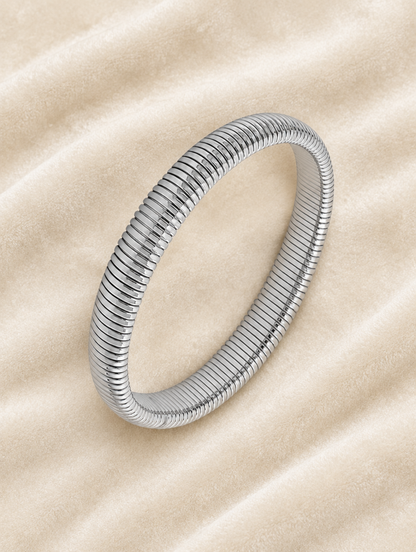 Silver ribbed stretch bracelet on cream velvet