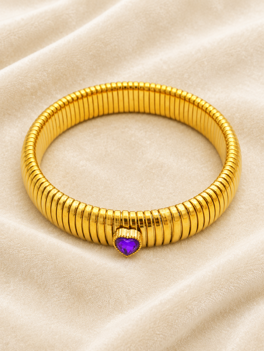Gold purple heart stretch bracelet on cream velvet
