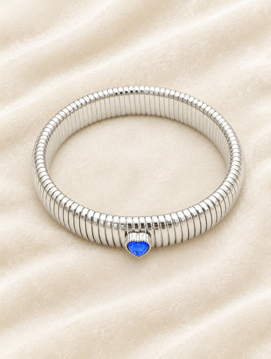 Silver blue heart stretch bracelet on cream velvet
