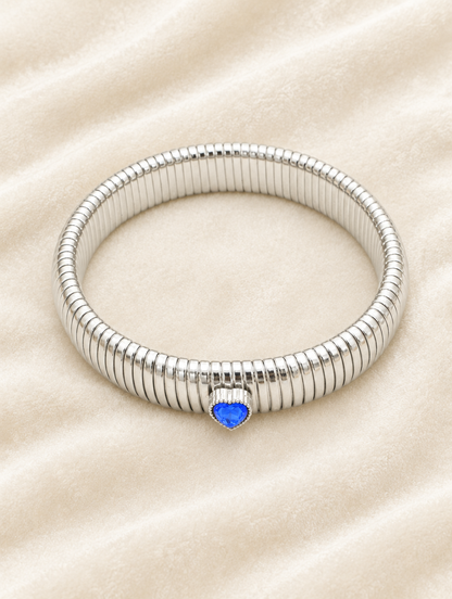 Silver blue heart stretch bracelet on cream velvet