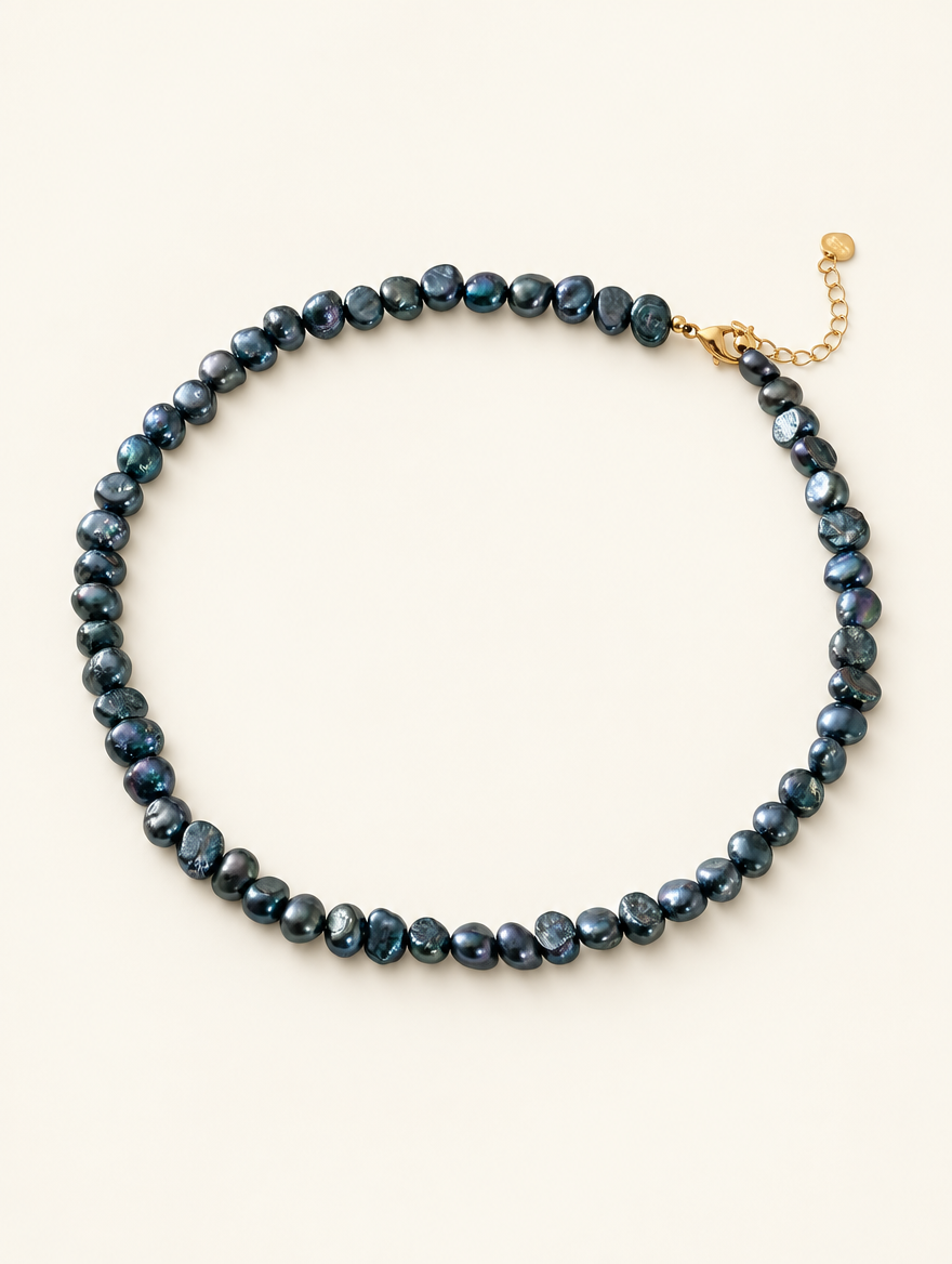 Black baroque freshwater pearl choker necklace on a neutral background