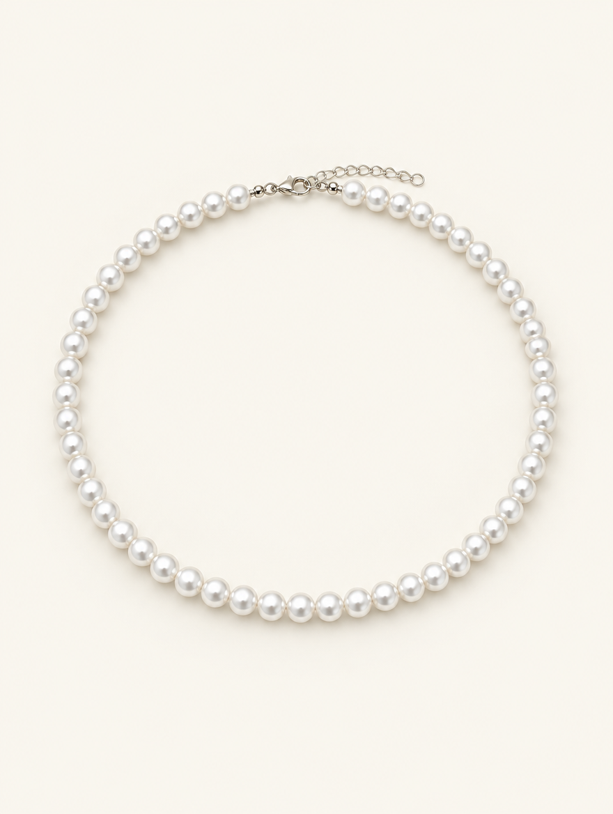 White pearl bead choker necklace with a silver-tone lobster clasp on a neutral background