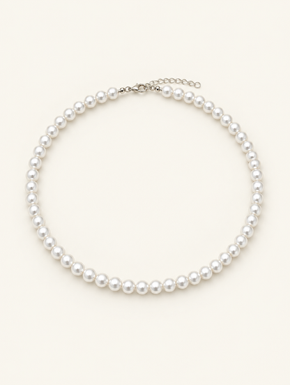 White pearl bead choker necklace with a silver-tone lobster clasp on a neutral background